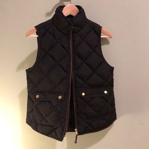 Black puffer vest with front pockets